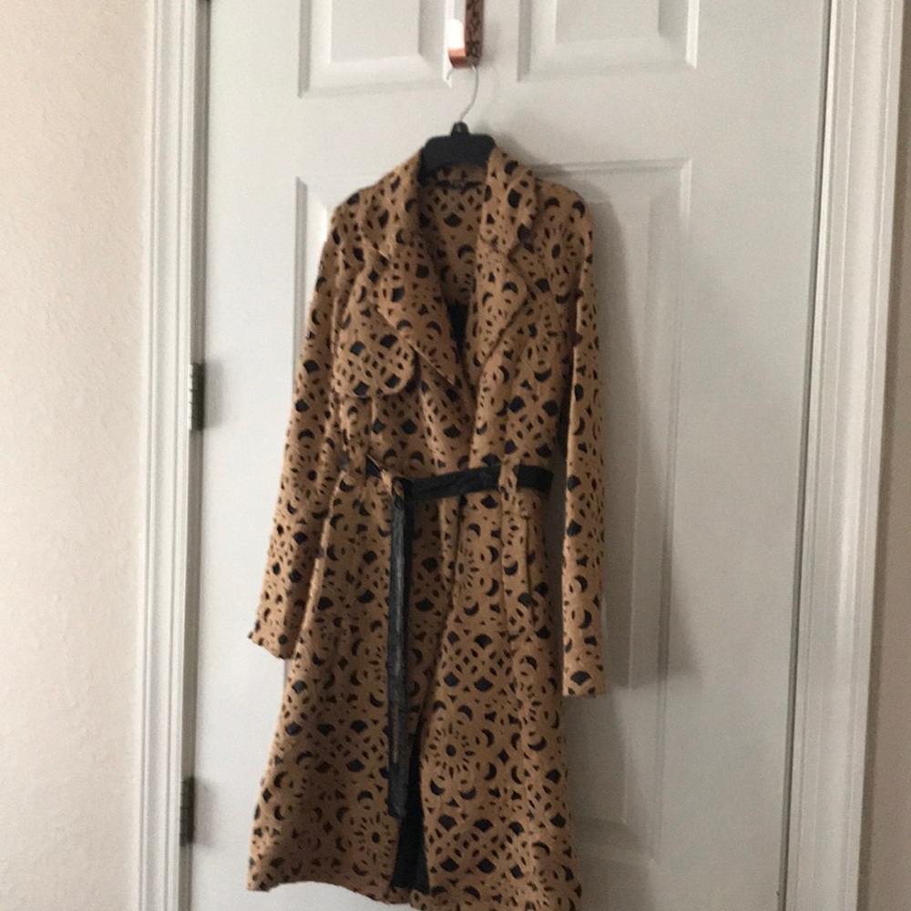 Beautiful laser cut trench coat. Caramel with black